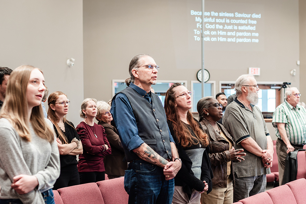 People worshipping during Sunday morning Church service